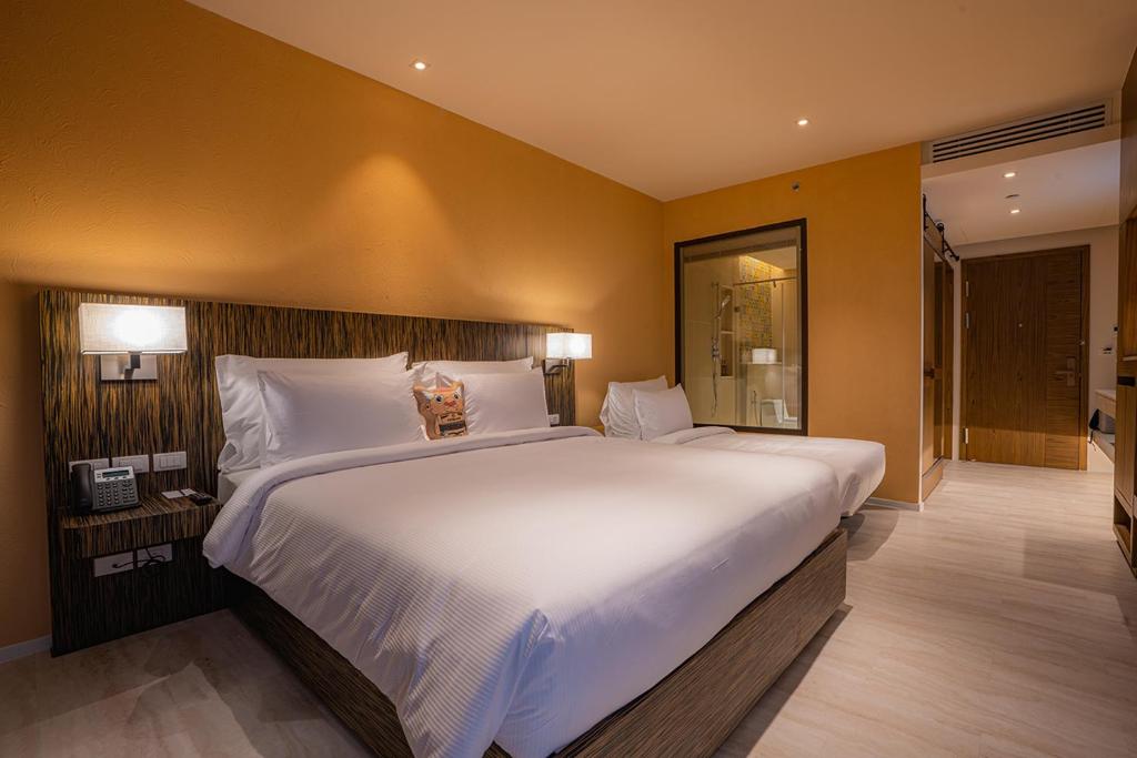 Ein Bett oder Betten in einem Zimmer der Unterkunft Pamookkoo