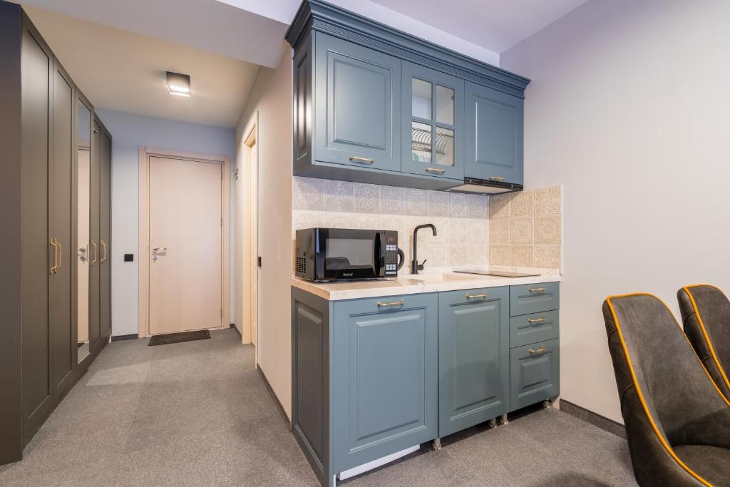 Kuchyň nebo kuchyňský kout v ubytování Studio Apartment in New Gudauri Redco Block F2