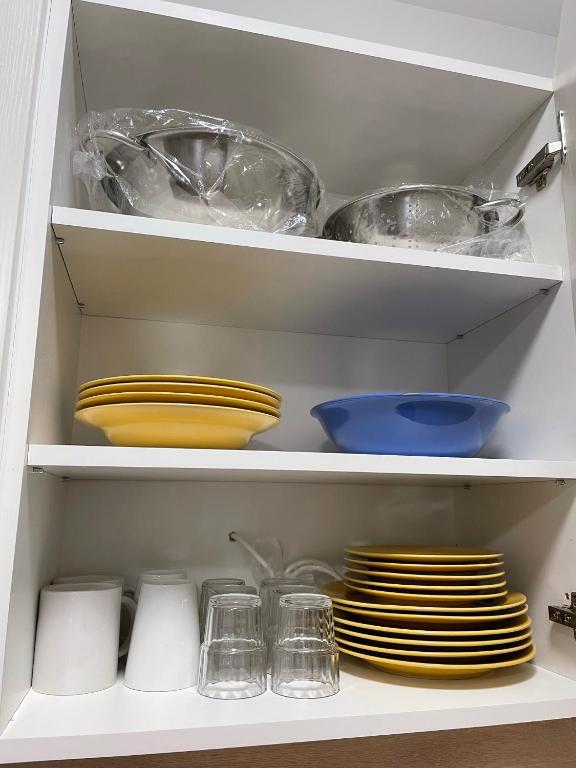 A kitchen or kitchenette at AA Apartman