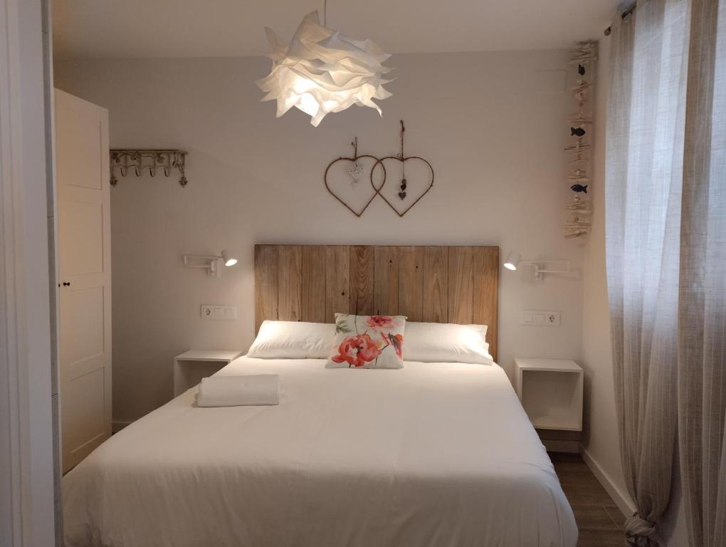 Postel nebo postele na pokoji v ubytování Casas Natura Suites