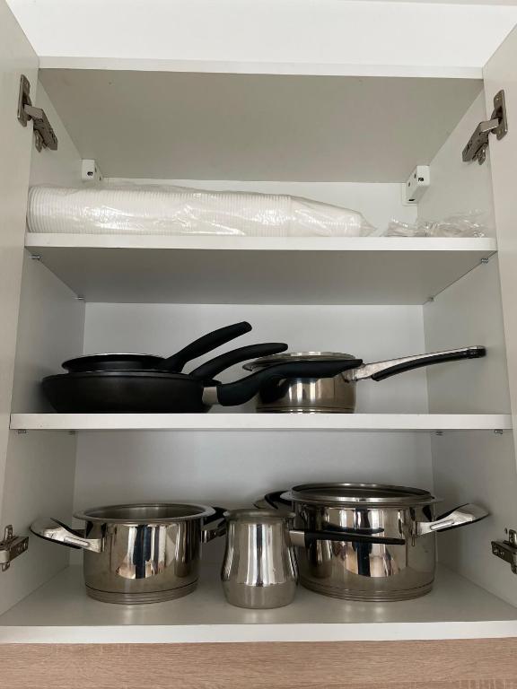 A kitchen or kitchenette at AA Apartman