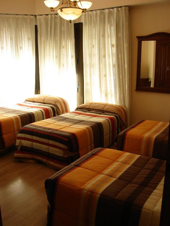 Voodi või voodid majutusasutuse Hostal Granada toas