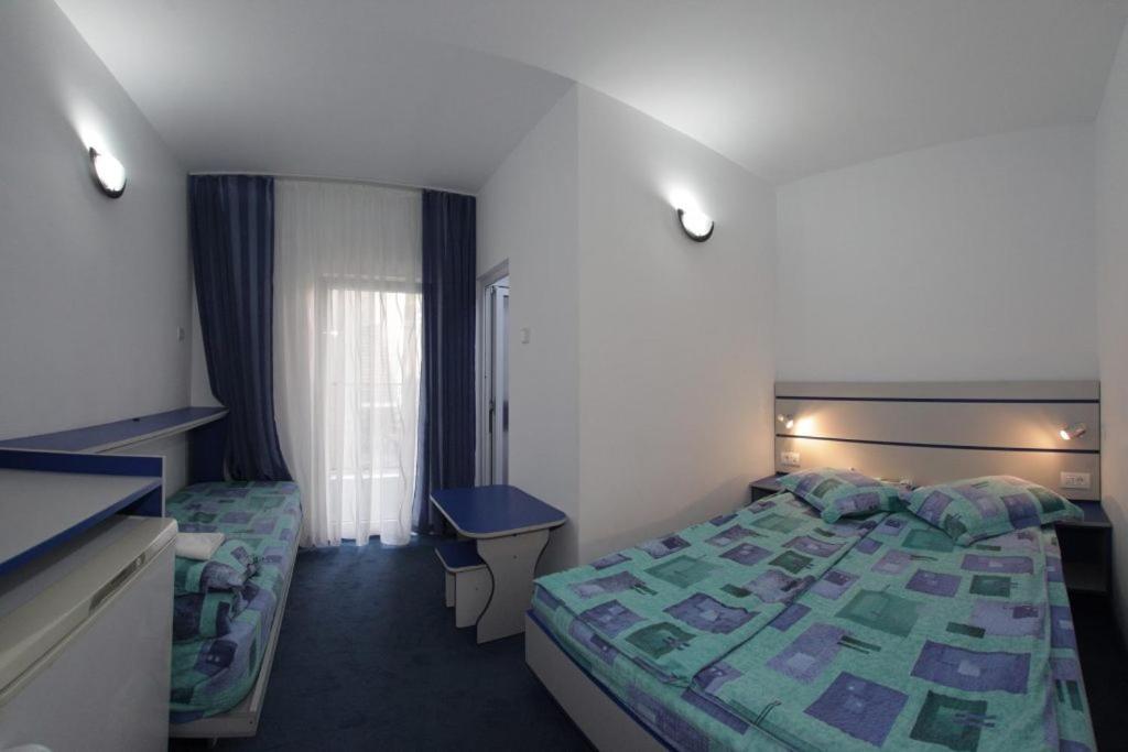 Postel nebo postele na pokoji v ubytování Vila Wolf