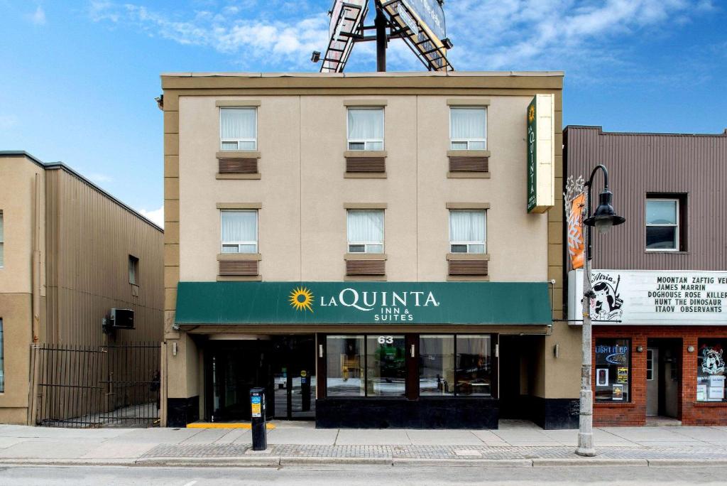 a building with a sign on the front of it at La Quinta by Wyndham Oshawa in Oshawa