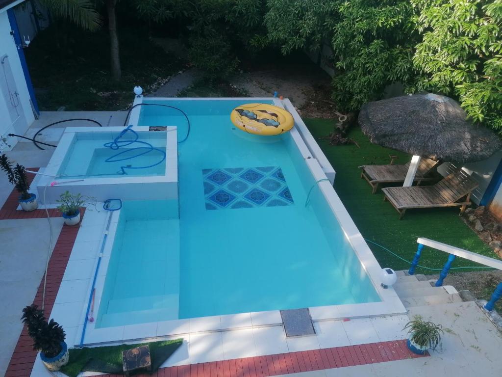 an overhead view of a blue swimming pool at Villa Jana, Bantayan, Santa Fe in Bantayan Island