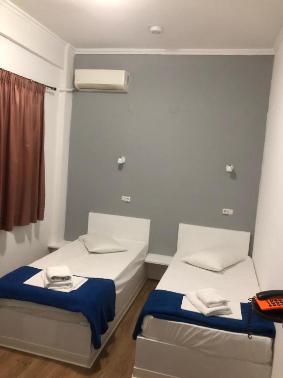 Letto o letti in una camera di Sparta Team Hotel