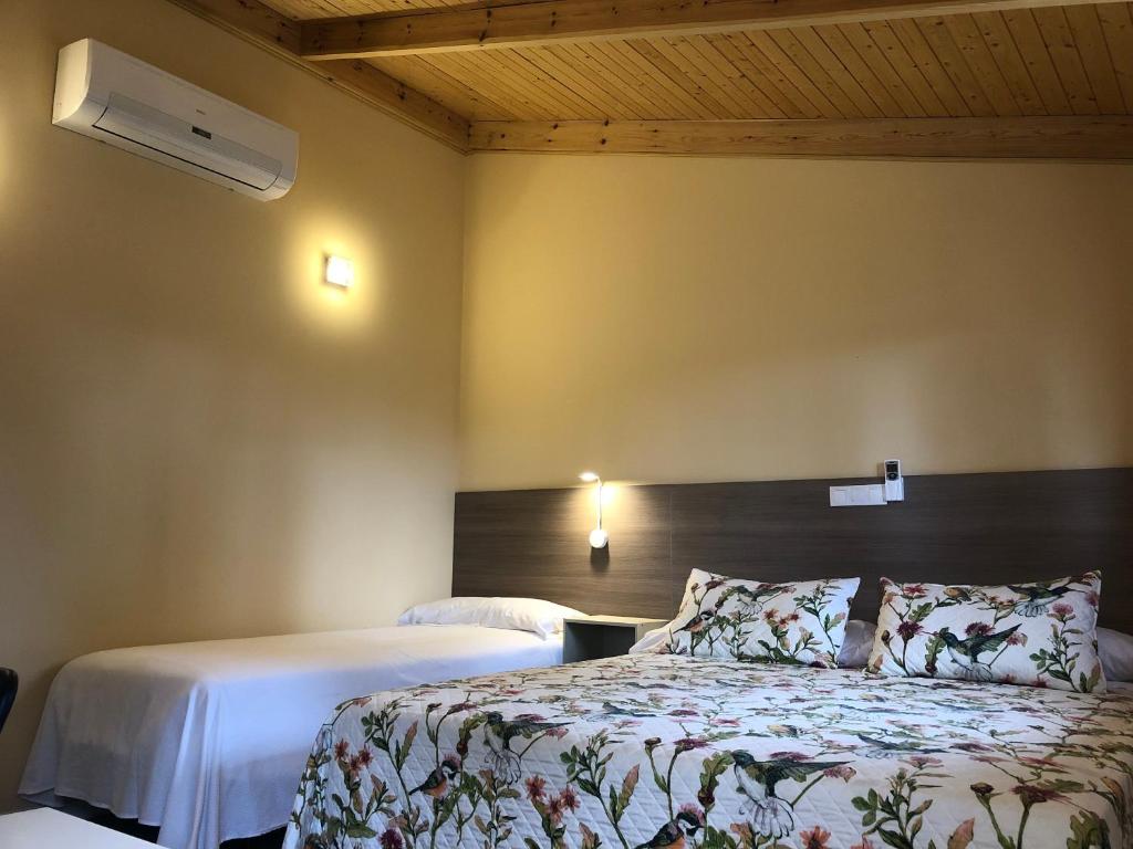Postel nebo postele na pokoji v ubytování Hostal La Posada de Mari