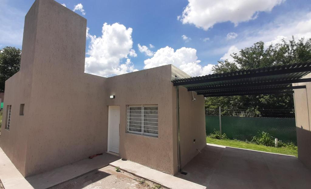 a rendering of a house with a garage at La Cañada in Juana Koslay 