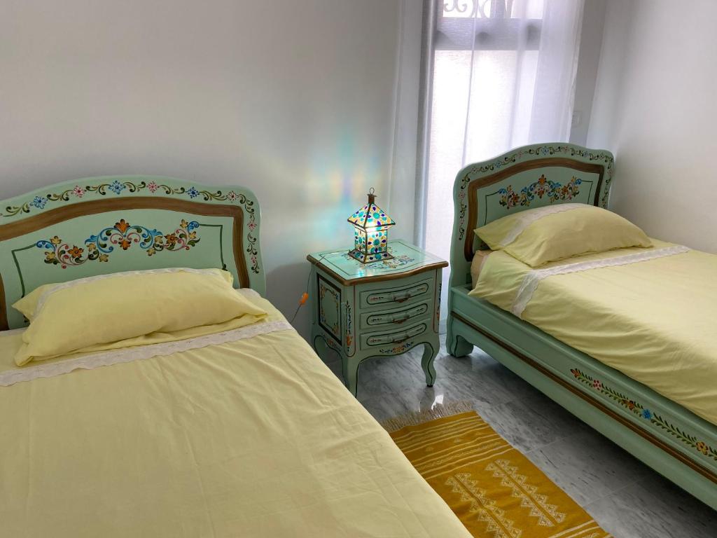 Postel nebo postele na pokoji v ubytování Marsa Authentic Luxury Appart 1