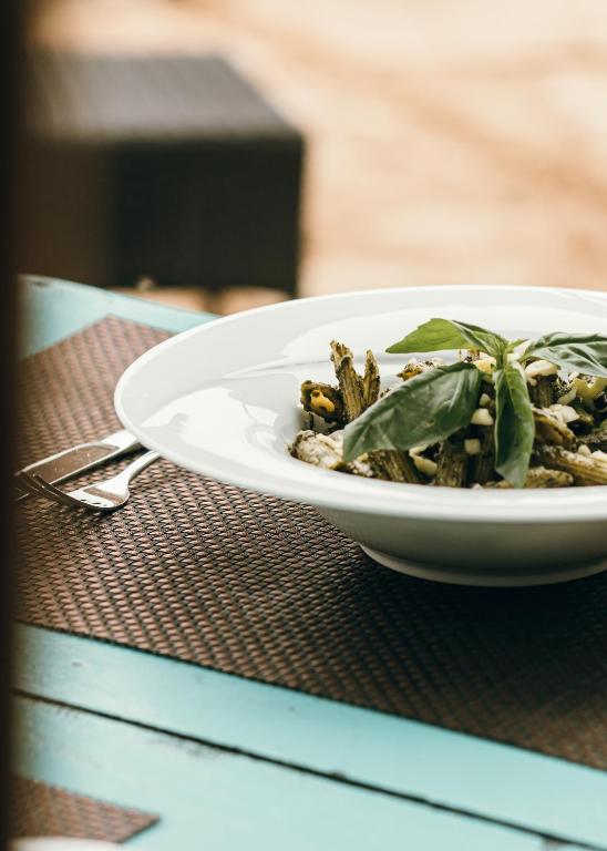 a white plate of food on a table at Salt Mirissa in Mirissa