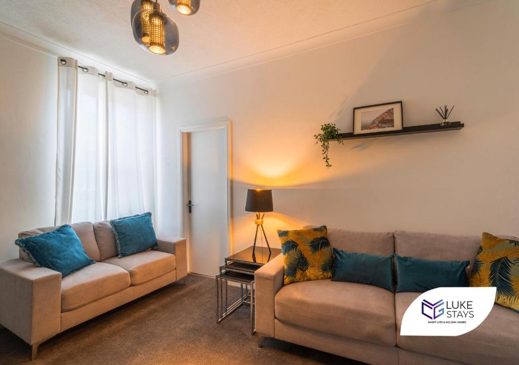 a living room with two couches and a window at Luke Stays - Brighton Road in Gateshead