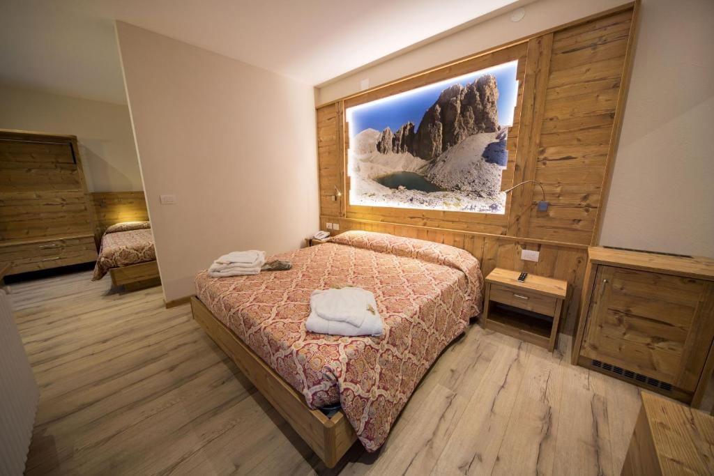Postel nebo postele na pokoji v ubytování Hotel Bellaria