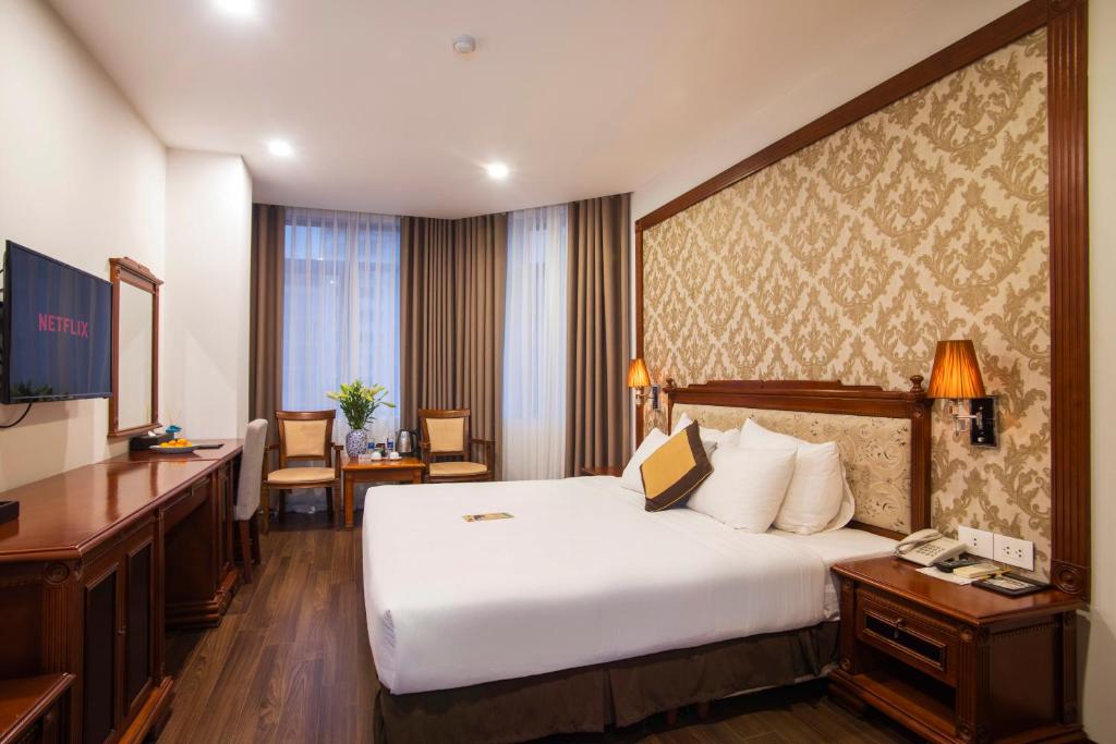 Postel nebo postele na pokoji v ubytování Western Hanoi Hotel
