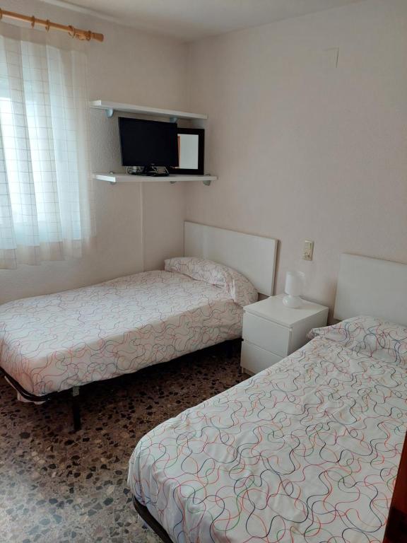 Postel nebo postele na pokoji v ubytování Apartamento Bellavista