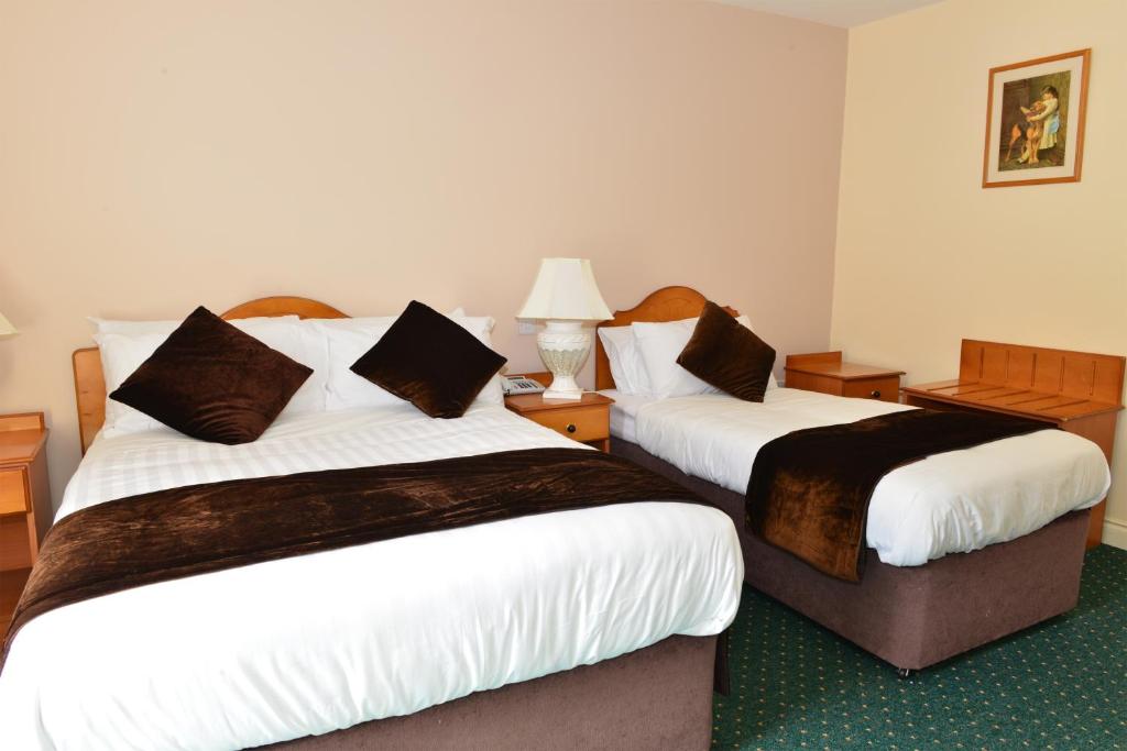 Postel nebo postele na pokoji v ubytování Murphy's Hotel