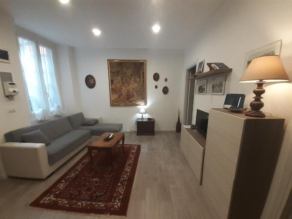 a living room with a couch and a tv in it at Casa Calù in Genoa