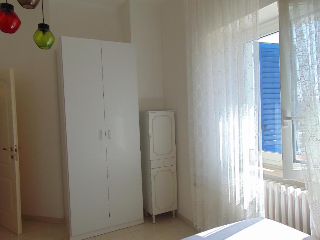 A bed or beds in a room at N019 - Numana, prestigioso quadrilocale vista mare