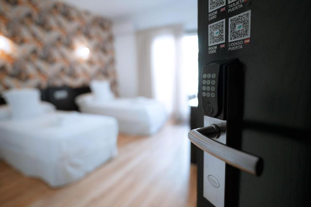 Posteľ alebo postele v izbe v ubytovaní Hotel Ventus