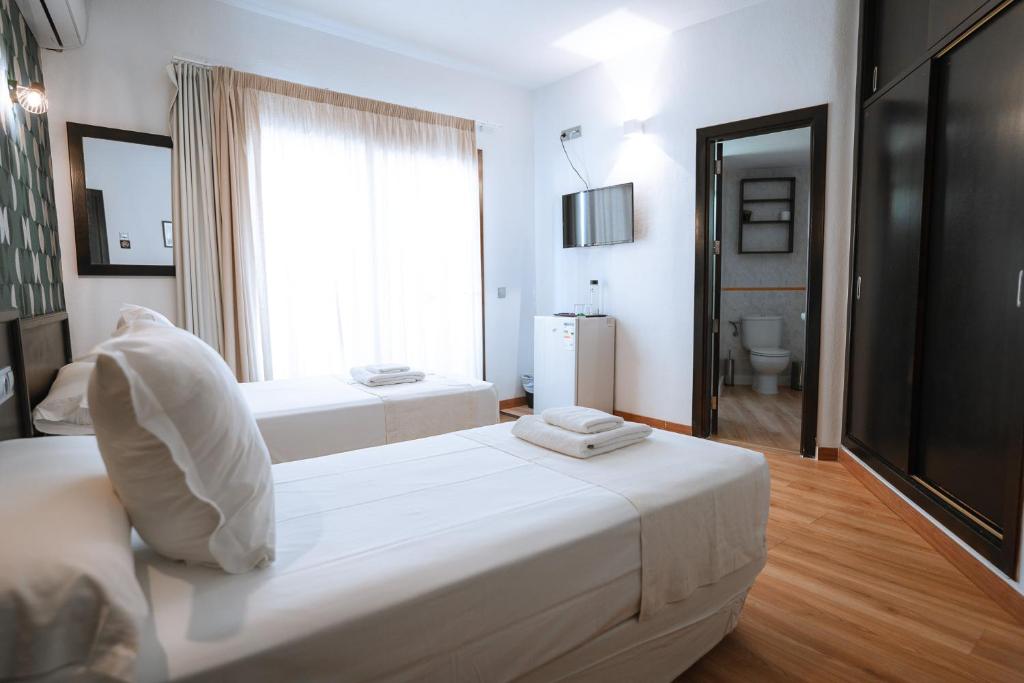 Posteľ alebo postele v izbe v ubytovaní Hotel Ventus
