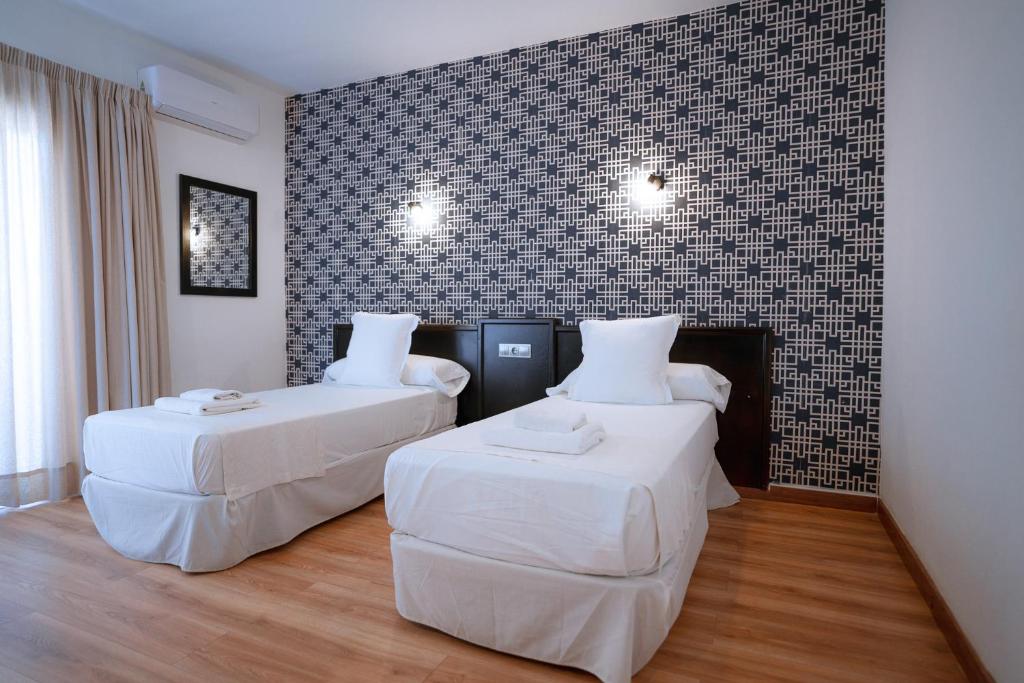 Posteľ alebo postele v izbe v ubytovaní Hotel Ventus