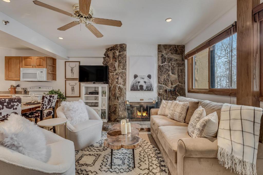 a living room with a couch and a table at Laurelwood Condominiums 304 in Snowmass Village