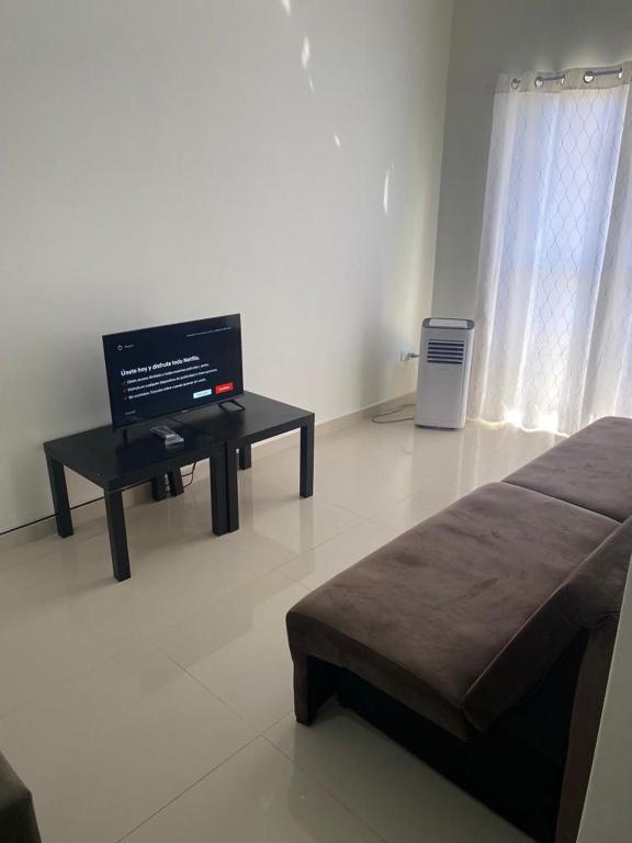 TV a/nebo společenská místnost v ubytování España Suites Hotel