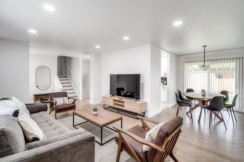 a living room with a couch and a table at @ Marbella - Spacious and Modern Home in Arvada in Arvada
