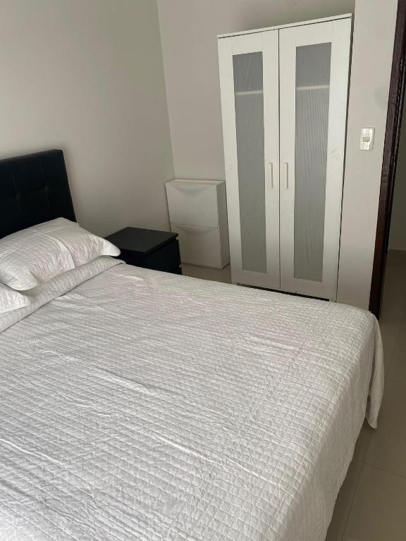 Postel nebo postele na pokoji v ubytování España Suites Hotel