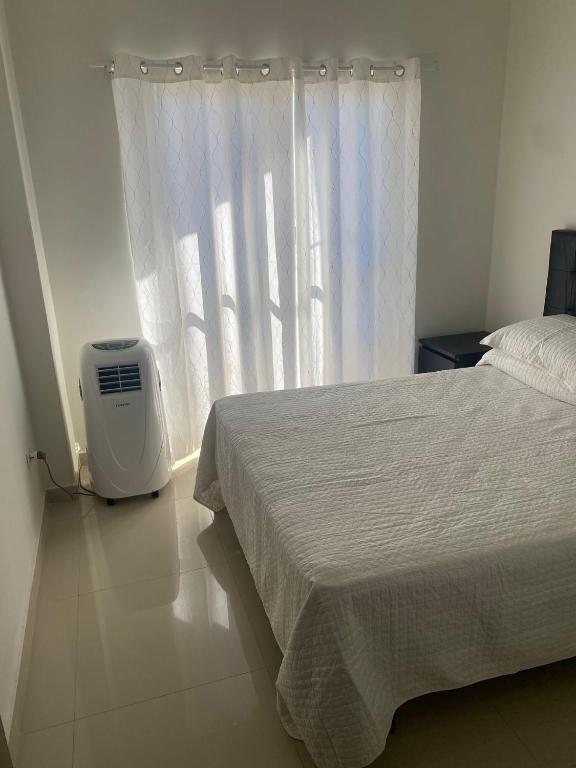 Postel nebo postele na pokoji v ubytování España Suites Hotel