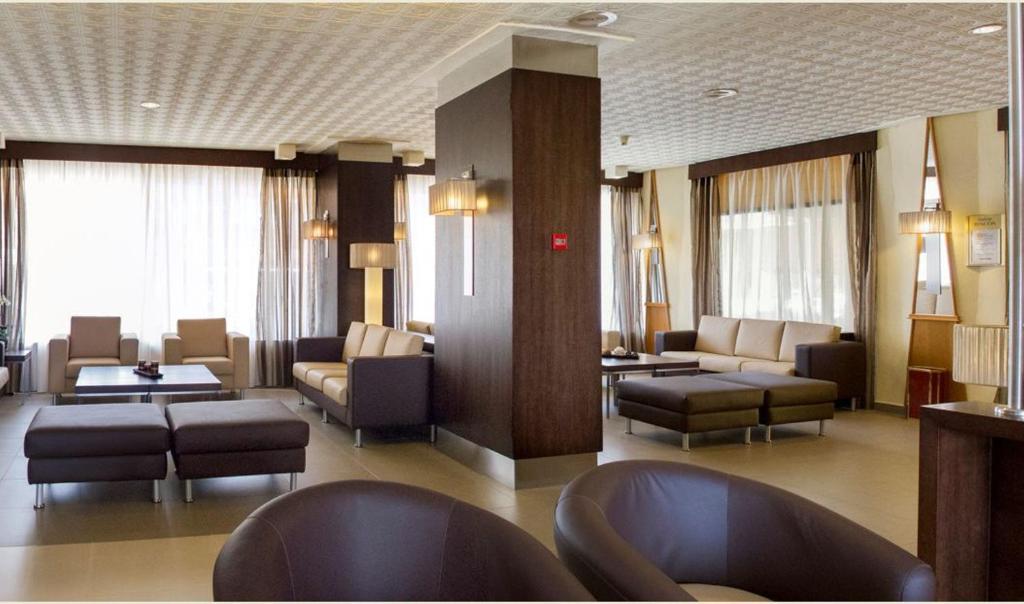 a waiting room with couches and chairs in a building at Rincón Sol in Rincón de la Victoria