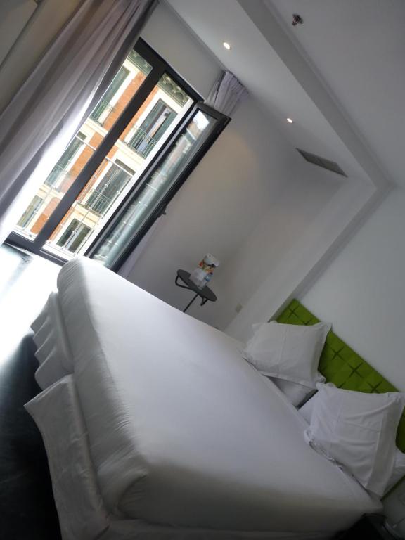 Tempat tidur dalam kamar di Mayerling Hotel