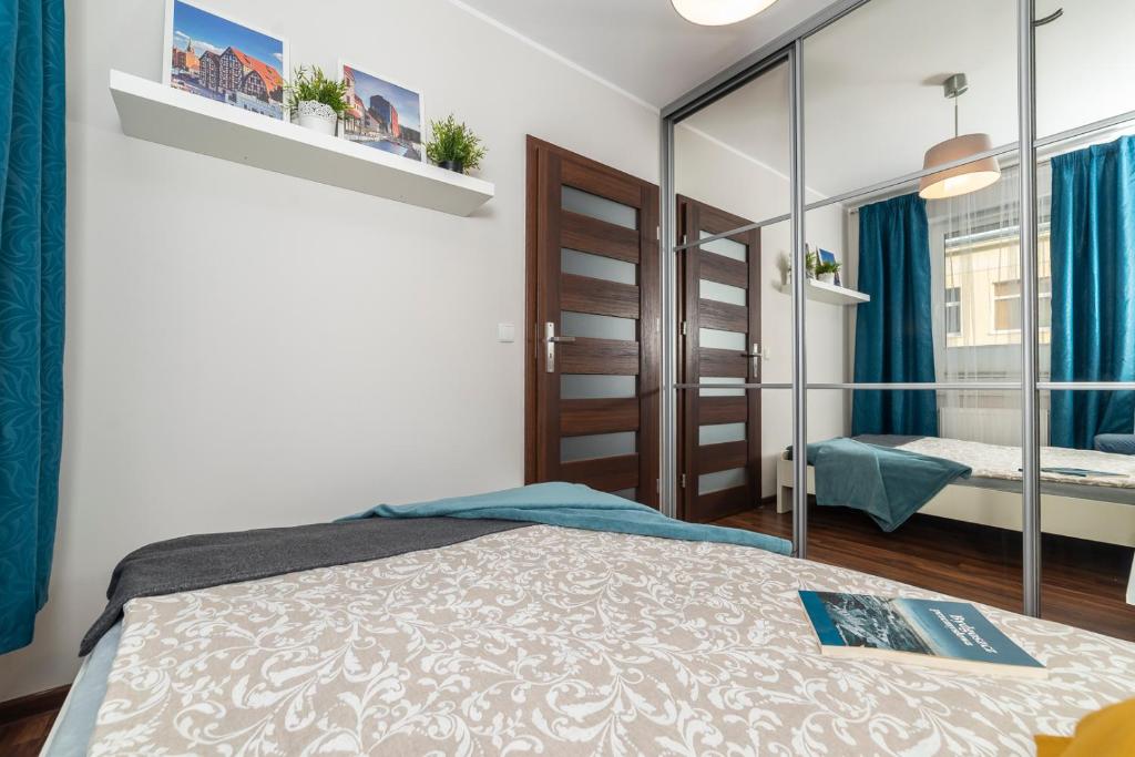 Posteľ alebo postele v izbe v ubytovaní Apartament Sobieskiego 2 Parking gratiss