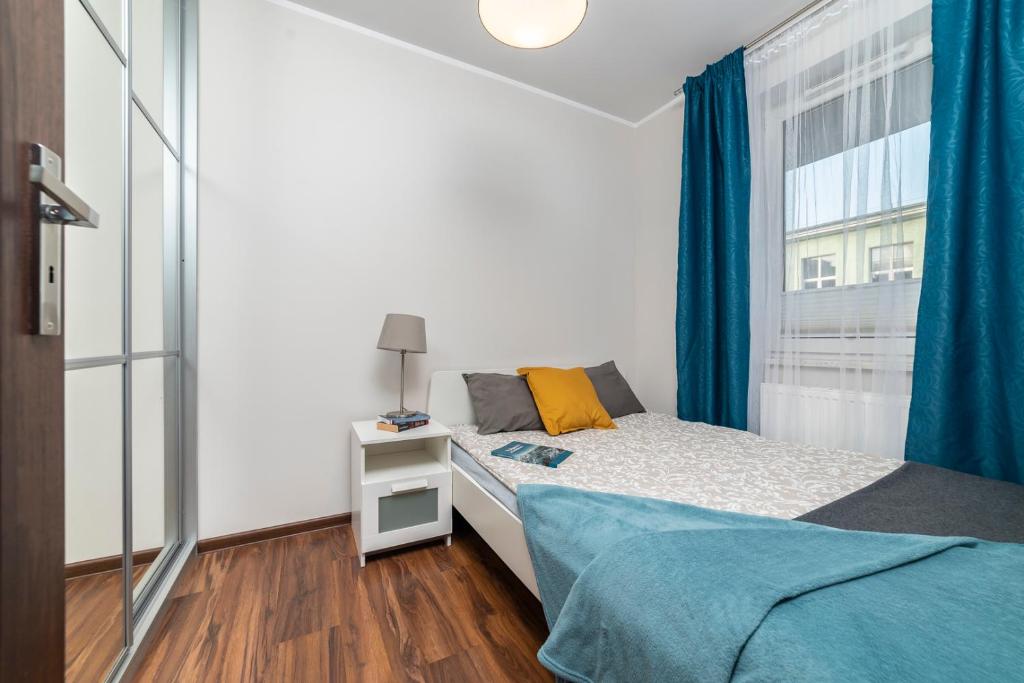 Posteľ alebo postele v izbe v ubytovaní Apartament Sobieskiego 2 Parking gratiss
