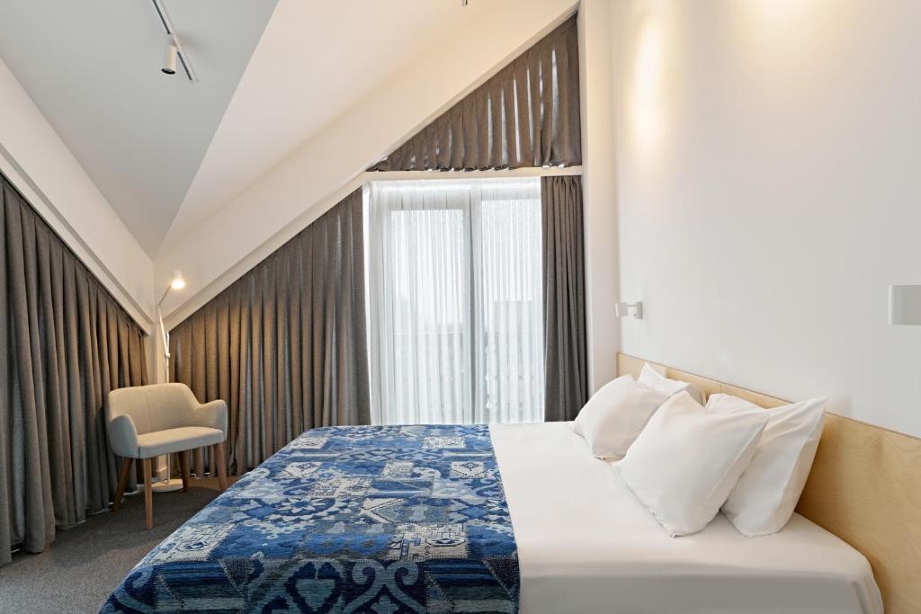 Postel nebo postele na pokoji v ubytování Dilijani Tun Hotel & Restaurant