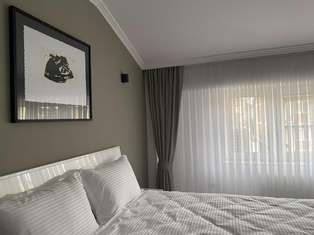 Postel nebo postele na pokoji v ubytování Hotel Callisto