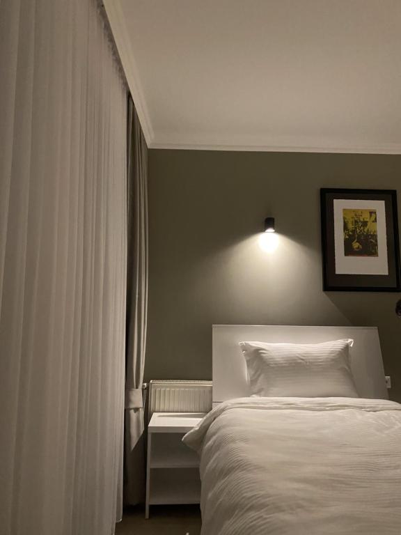 Postel nebo postele na pokoji v ubytování Hotel Callisto