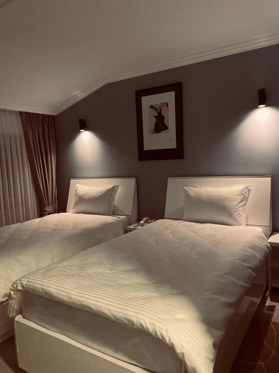 Postel nebo postele na pokoji v ubytování Hotel Callisto