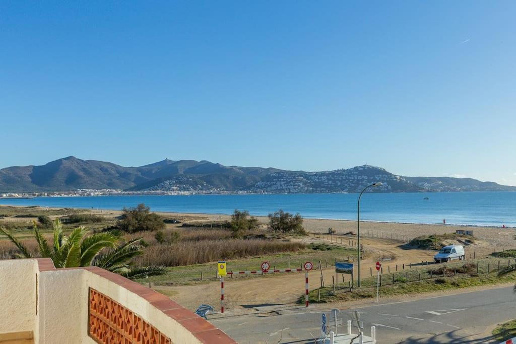 a view of a beach with the ocean and mountains at V020 - PUERTO PRIMERO in Empuriabrava