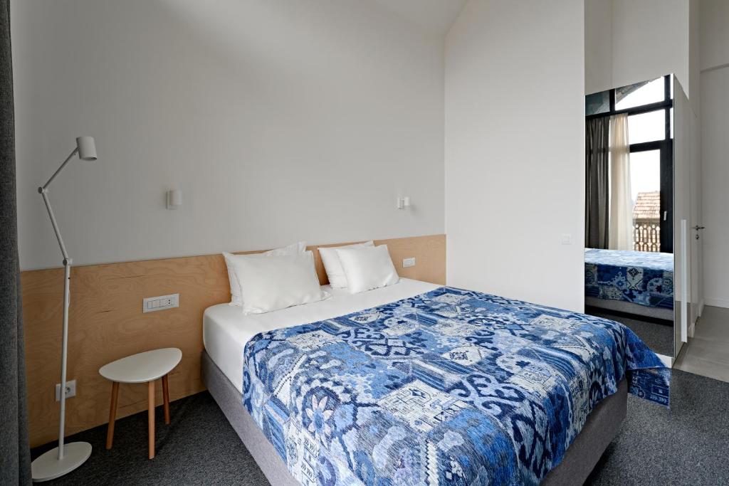 Postel nebo postele na pokoji v ubytování Dilijani Tun Hotel & Restaurant