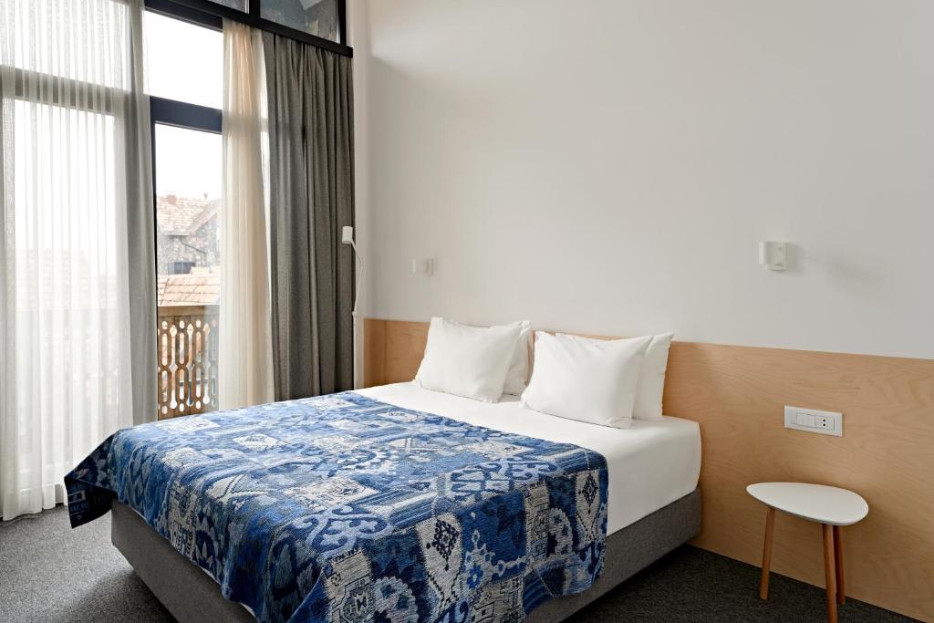 Postel nebo postele na pokoji v ubytování Dilijani Tun Hotel & Restaurant