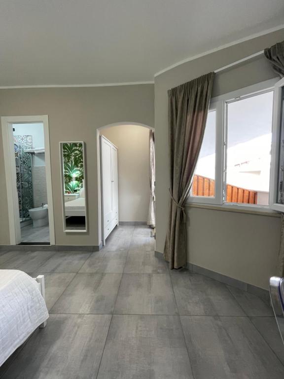Postel nebo postele na pokoji v ubytování ALDIVA ROOMS
