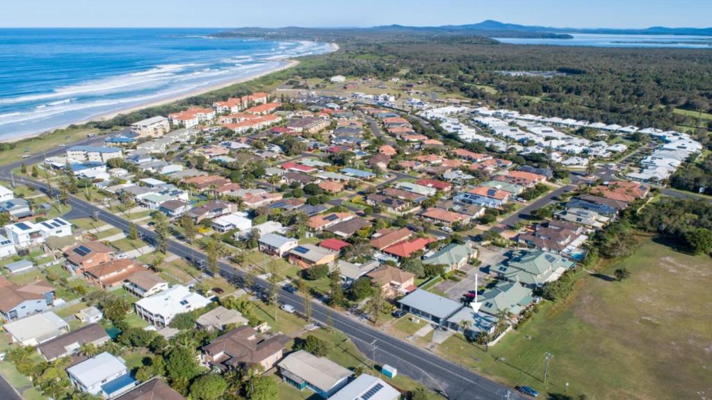 an aerial view of a suburb next to the beach at Sunnyvale unit 1 in Yamba