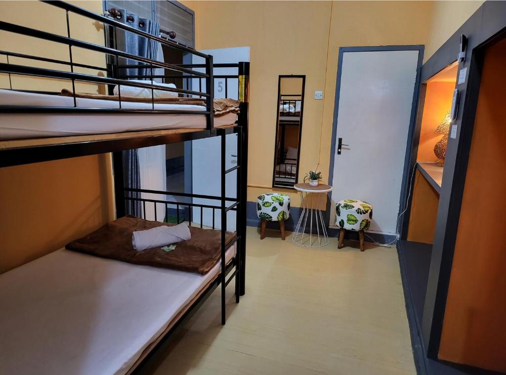 Postel nebo postele na pokoji v ubytování Dewi Sri Guesthouse