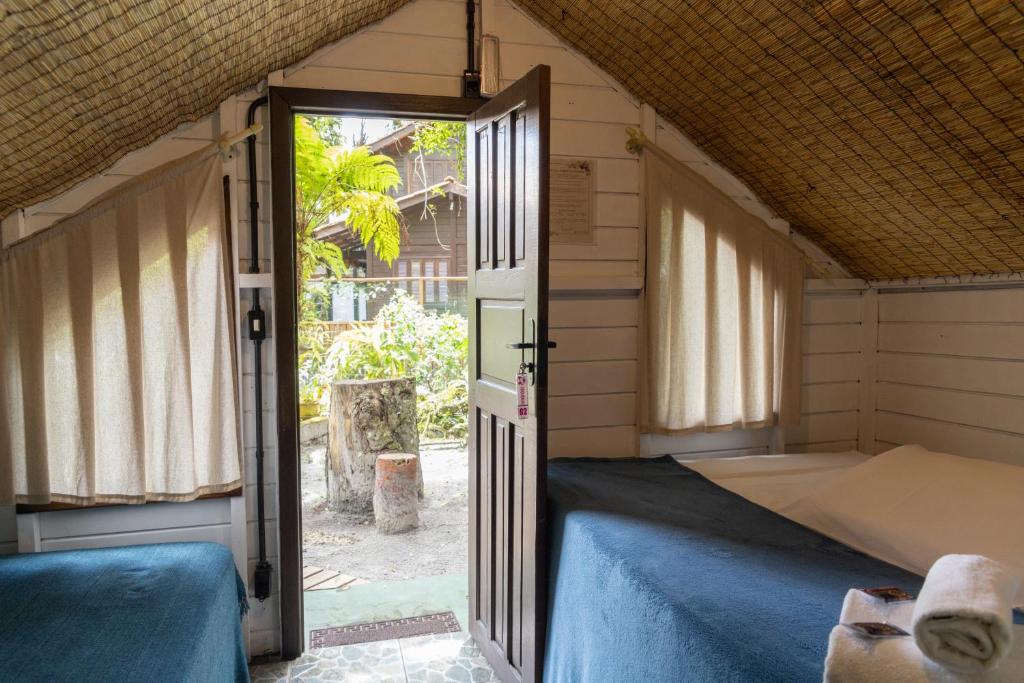 Postel nebo postele na pokoji v ubytování Pousada Orquideas