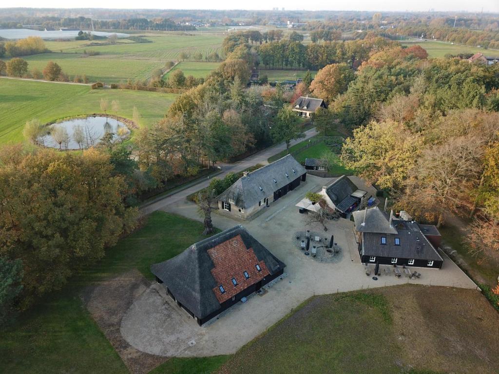 an aerial view of a large house with a yard at Jager en Hooijmijt in Gouwelaar