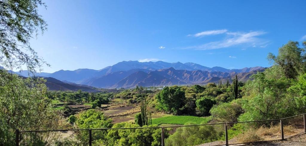 a view of a valley with mountains in the distance at Casa de CAMPO HUAKA HUASY in Cachí