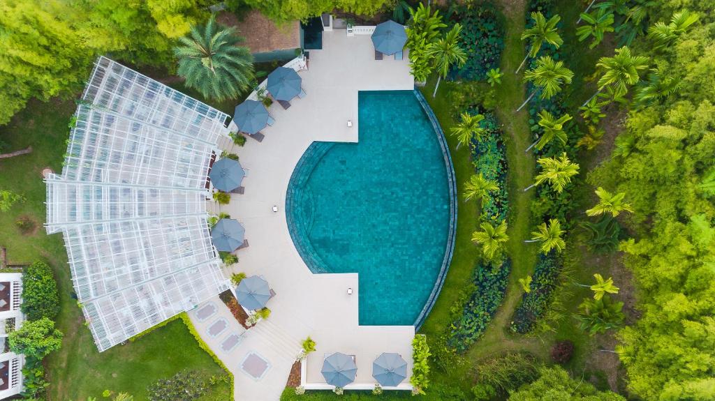 an aerial view of a pool at a resort at The Luang Say Residence in Luang Prabang