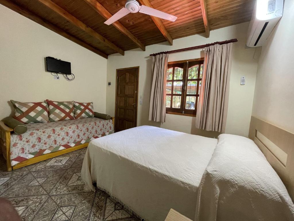 Tempat tidur dalam kamar di La Posada de Moncho
