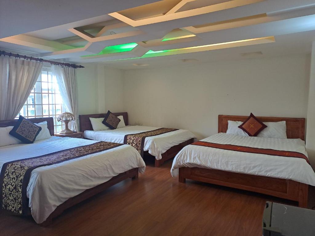 Postel nebo postele na pokoji v ubytování Thien Phu Guesthouse Dalat