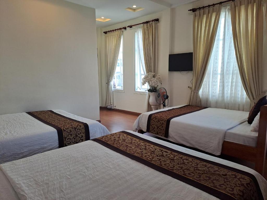 Postel nebo postele na pokoji v ubytování Thien Phu Guesthouse Dalat